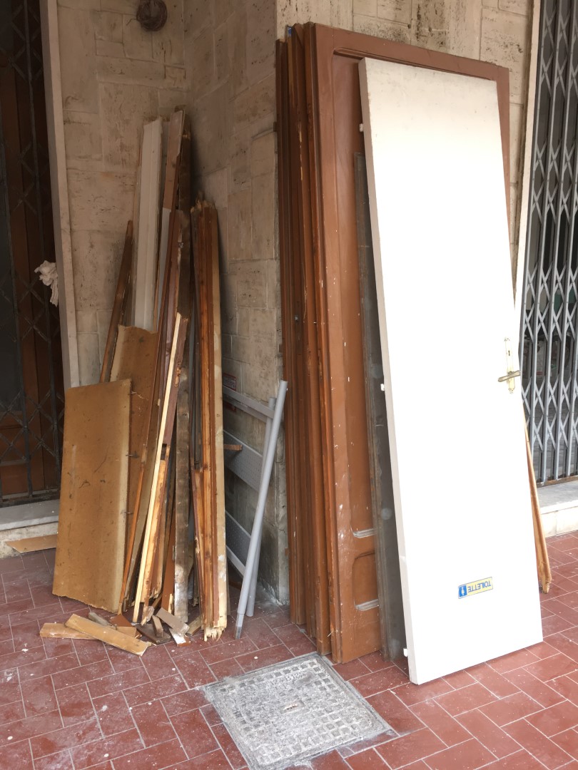 Old doors piled up with glasses